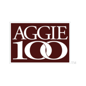 A logo featuring the word ‘AGGIE’ in large white letters on a maroon background, with the number ‘100’ in a stylized font and a trademark symbol, representing a significant milestone or achievement