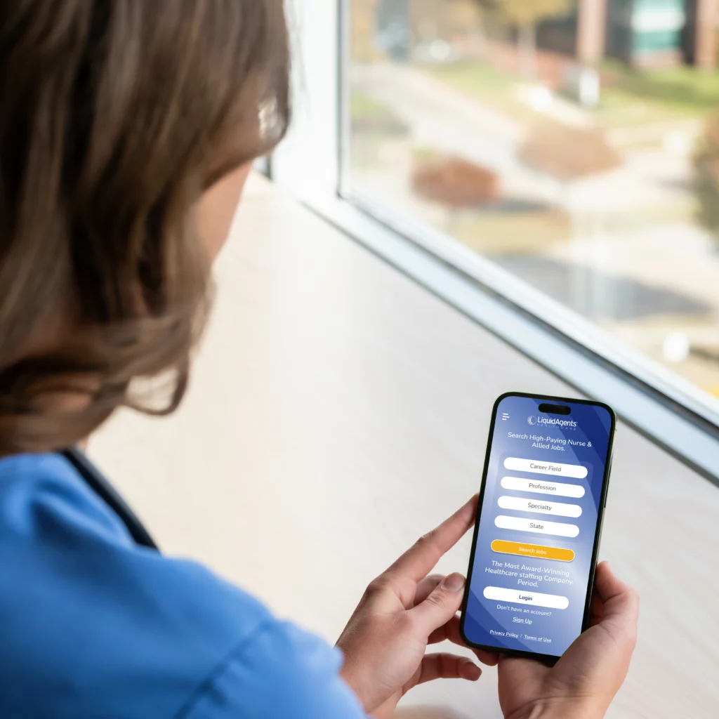 Over the shoulder view of female nurse using the LiquidAgents mobile app